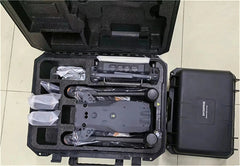 DJI Matrice 30T folded in an open carrying case beside a second hard case